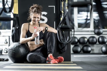 woman rests at the gym